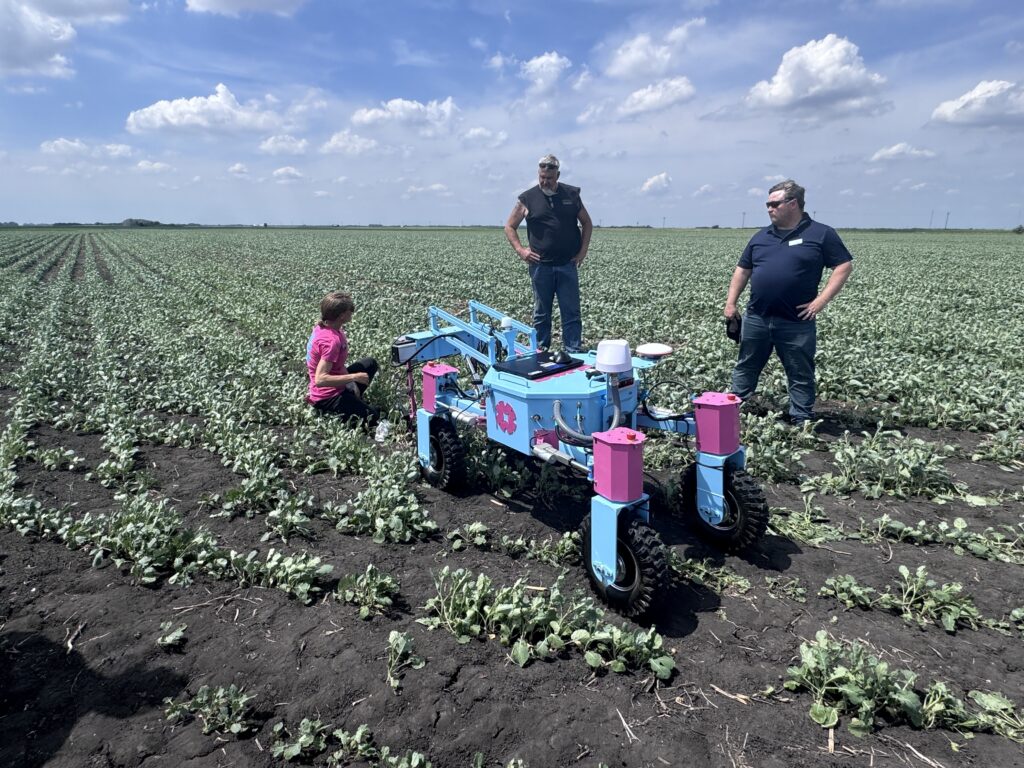 Attendees of Ag Tech Week observe new agriculture technology in the field.